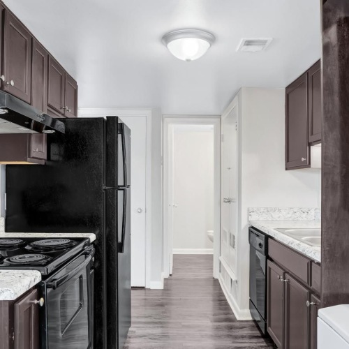 a kitchen with wooden cabinets
