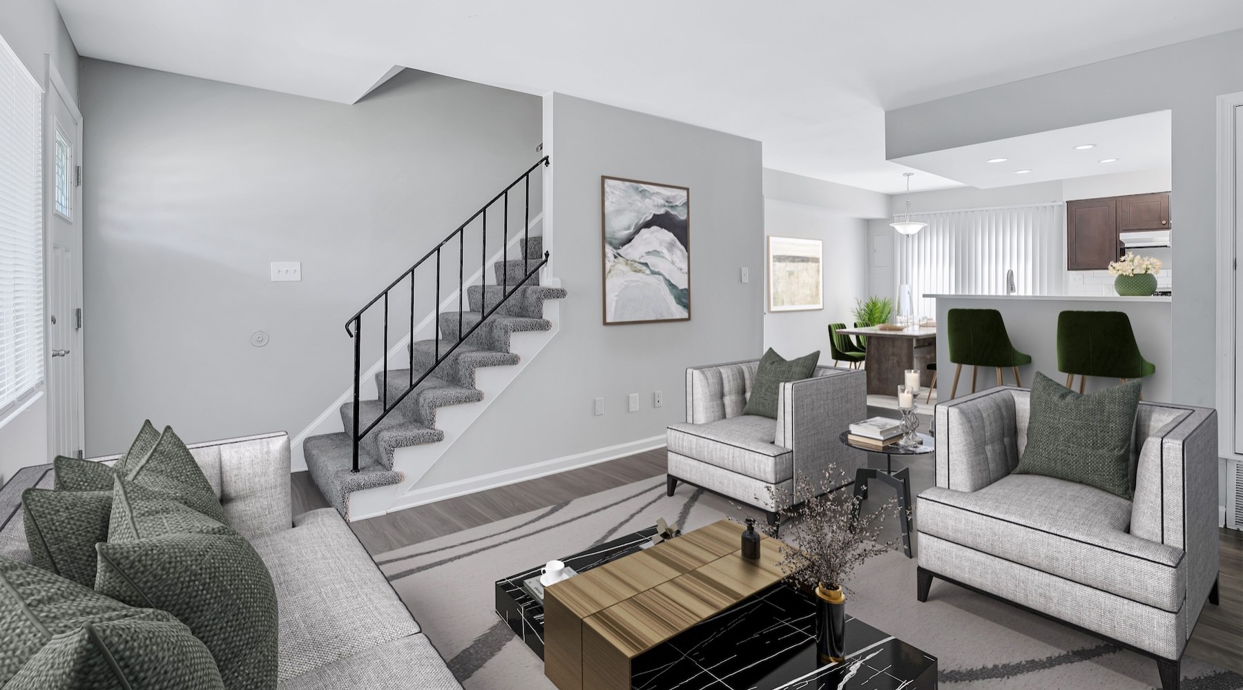living room with seating table and stairwell